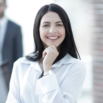 Photograph of a female student smiling looking at camera