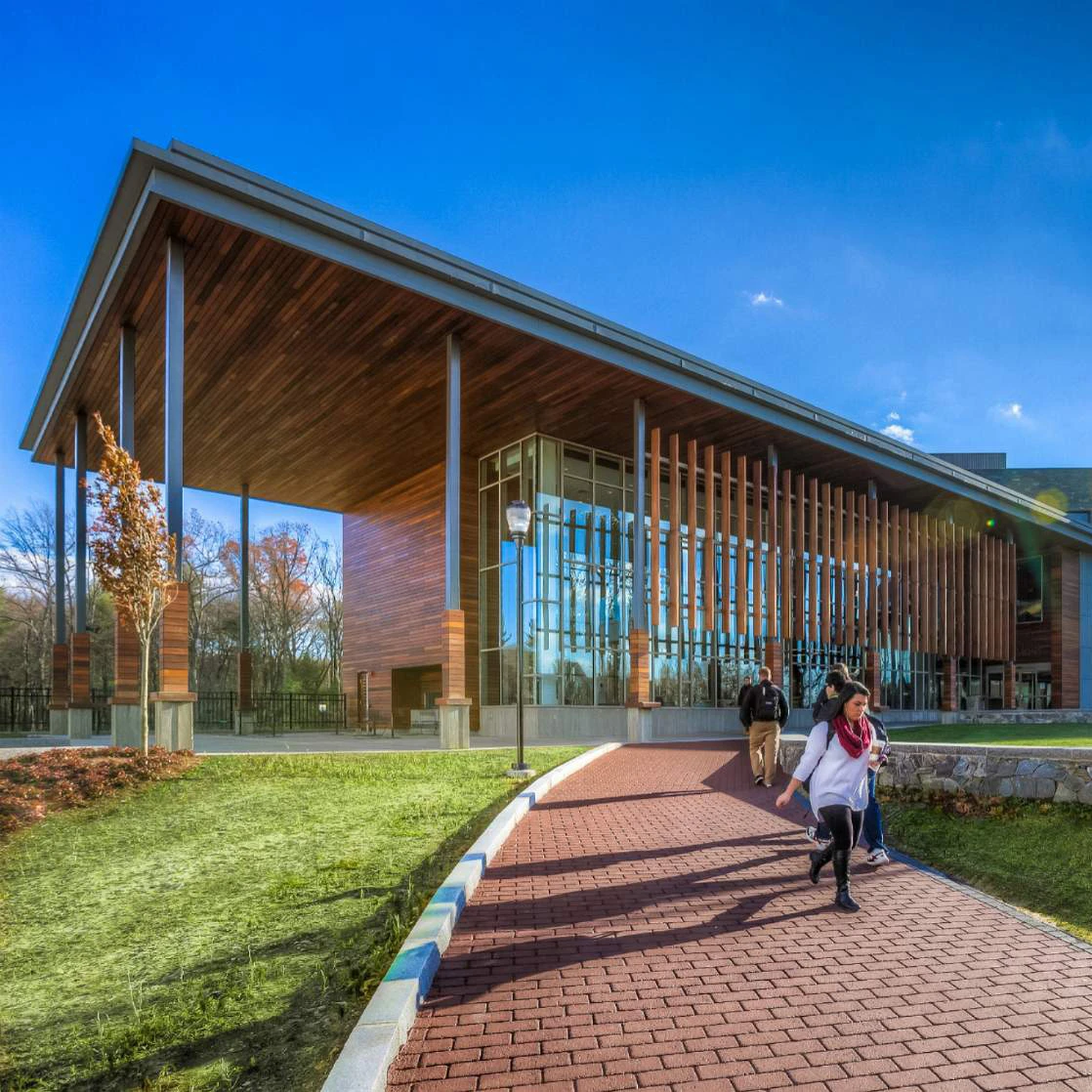Photograph of student walking on the SNHU Campus
